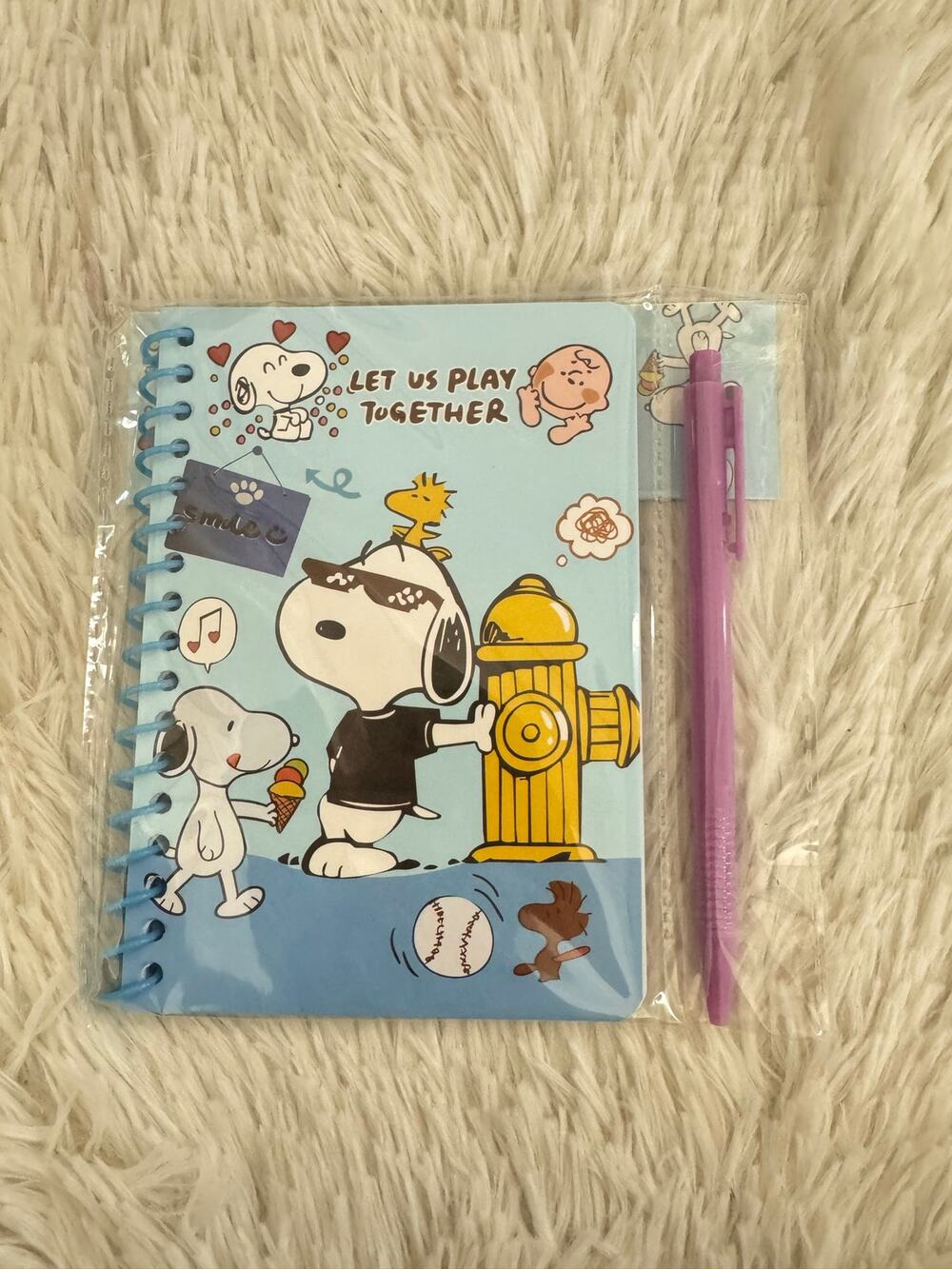 Snoopy blue spiral notebook with designs and a pen size A6